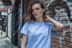 Woman wearing blue t shirt and glasses image Product Image 1