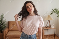 Woman wearing pink t shirt and jeans image Product Image 1