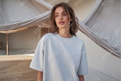 Woman wearing light grey sweatshirt Product Image 1