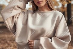Woman wearing beige sweatshirt outdoors casual Product Image 1