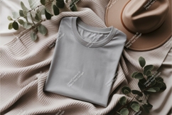 Folded gray shirt with hat mockup Product Image 1