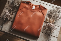 Brown sweatshirt on wooden surface mockup Product Image 1