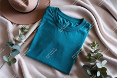 Folded teal shirt with hat mockup Product Image 1