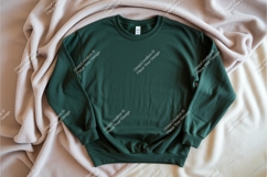 Green sweatshirt on blanket mockup Product Image 1