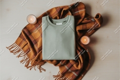 Folded sweatshirt with blanket mockup Product Image 1