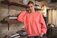 Woman in sweatshirt leaning on shelf mockup Product Image 1