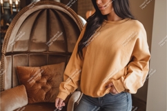 Woman wearing yellow sweatshirt mockup Product Image 1