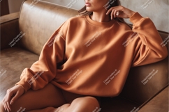 Woman in sweatshirt on couch mockup Product Image 1