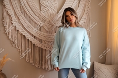 Woman wearing light blue sweatshirt mockup Product Image 1