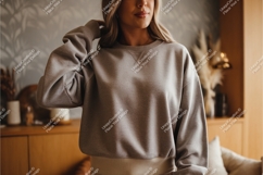 Woman in a gray sweatshirt mockup Product Image 1