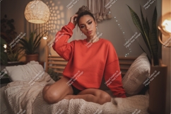 Woman in sweatshirt sitting on bed mockup Product Image 1