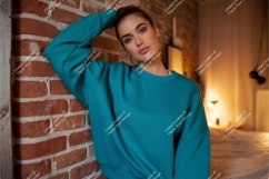 Woman in blue sweatshirt leaning mockup Product Image 1