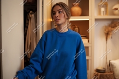Woman in blue top looking away mockup Product Image 1