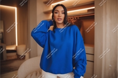 Woman in blue sweatshirt mockup Product Image 1