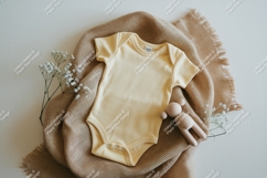 Yellow baby bodysuit on blanket mockup Product Image 1