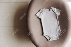 Gray baby bodysuit on chair mockup Product Image 1