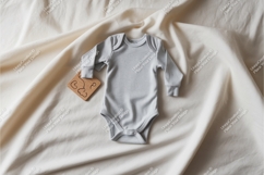 Gray baby bodysuit on fabric mockup Product Image 1