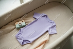 Peach baby onesie with book mockup Product Image 1