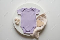 Beige baby onesie on chair mockup Product Image 1
