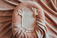 Pink baby onesie on soft cushion mockup Product Image 1