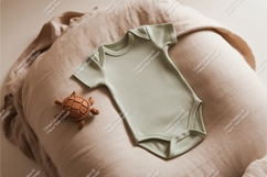 Green baby onesie with toy mockup Product Image 1