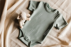 Sage baby onesie with lamb toy mockup Product Image 1
