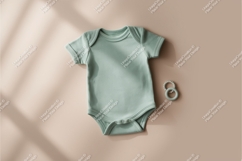 Green baby onesie with teether mockup Product Image 1