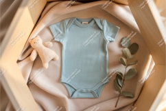 Blue baby bodysuit with toy and plant mockup Product Image 1