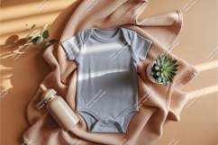 A gray baby onesie with accessories mockup Product Image 1