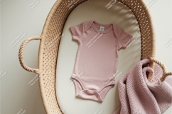 Pink baby bodysuit in bassinet mockup Product Image 1