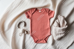 Salmon baby onesie with muslin blanket mockup Product Image 1
