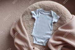 Baby bodysuit on a fluffy pillow mockup Product Image 1