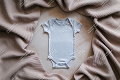White baby bodysuit surrounded by fabric mockup Product Image 1