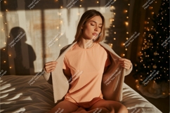 Woman wearing peach t shirt and cardigan Product Image 1