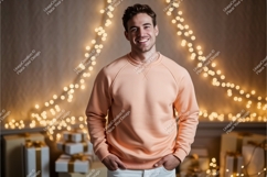 Man wearing peach sweatshirt with festive lights Product Image 1