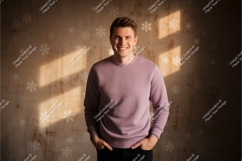 Smiling man wearing purple sweatshirt Product Image 1