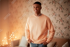 Man wearing peach sweatshirt casual denim Product Image 1