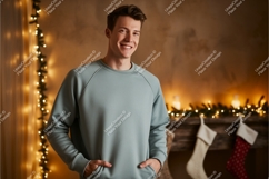 Young man wearing light blue sweatshirt casual indoor Product Image 1