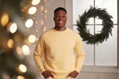 Man wearing yellow sweatshirt with Christmas wreath Product Image 1