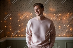 Man wearing pink sweatshirt indoors lights Product Image 1