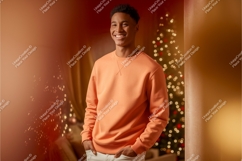 Young man orange sweatshirt mockup smiling Product Image 1