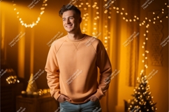 Man wearing peach sweatshirt festive lights image Product Image 1