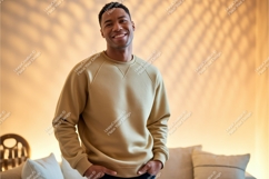 Man wearing tan sweatshirt indoors casual Product Image 1