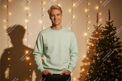 Man wearing mint green sweatshirt with Christmas tree Product Image 1