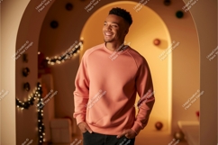 Man wearing coral sweatshirt indoors smiling casual Product Image 1