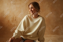 Woman wearing cream sweatshirt casual fashion Product Image 1