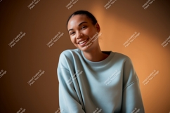 Young woman smiling wearing light blue sweatshirt Product Image 1