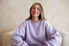 Young woman laughing wearing lavender sweatshirt happy Product Image 1