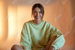 Young woman wearing light green sweatshirt smiling Product Image 1