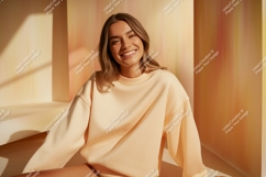 Smiling woman wearing peach sweatshirt casual Product Image 1